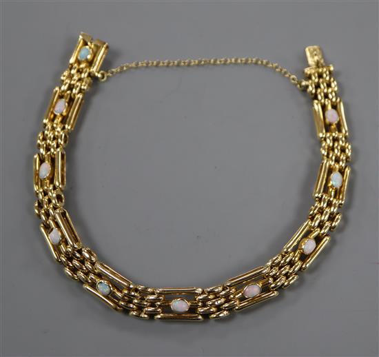 An 18ct and white opal set gate link bracelet.